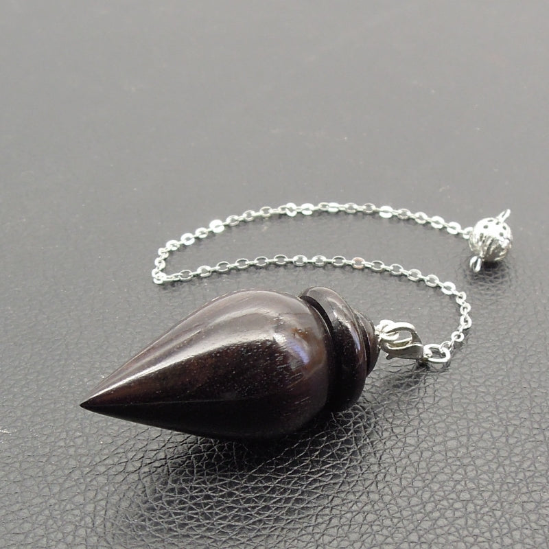Pendule artisanal divinatoire de radiesthésie en ébène avec chainette.