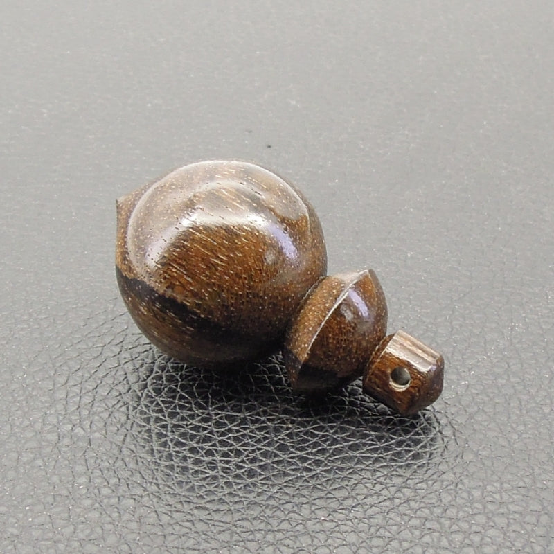 Pendule artisanal de radiesthésie en ziricote avec oeilleton.