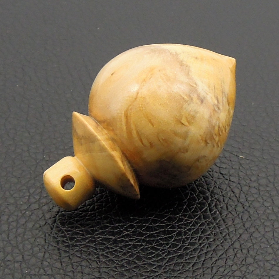 Pendule artisanal de radiesthésie en loupe de buis avec oeilleton.