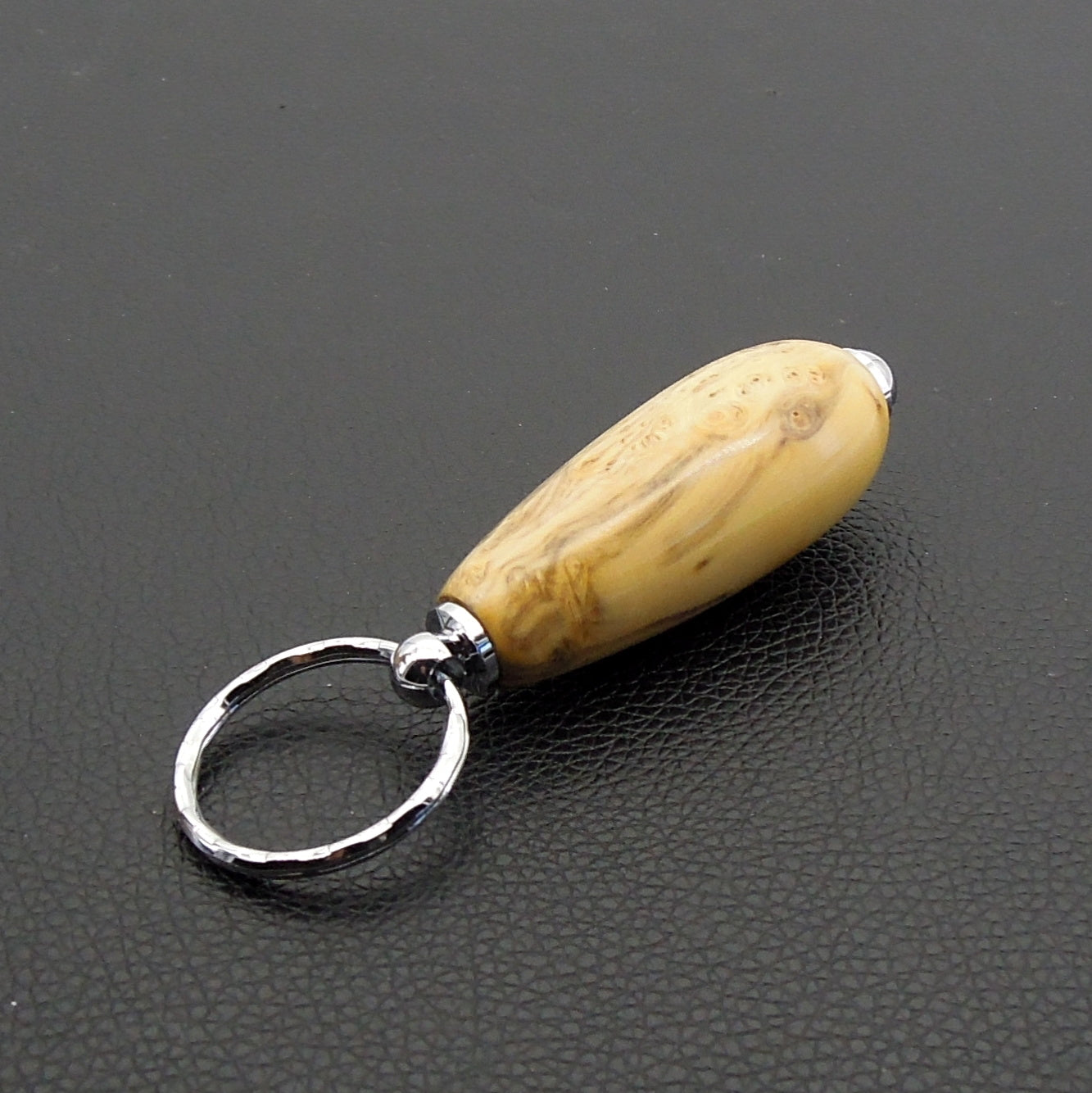 Porte clefs buis échauffé.