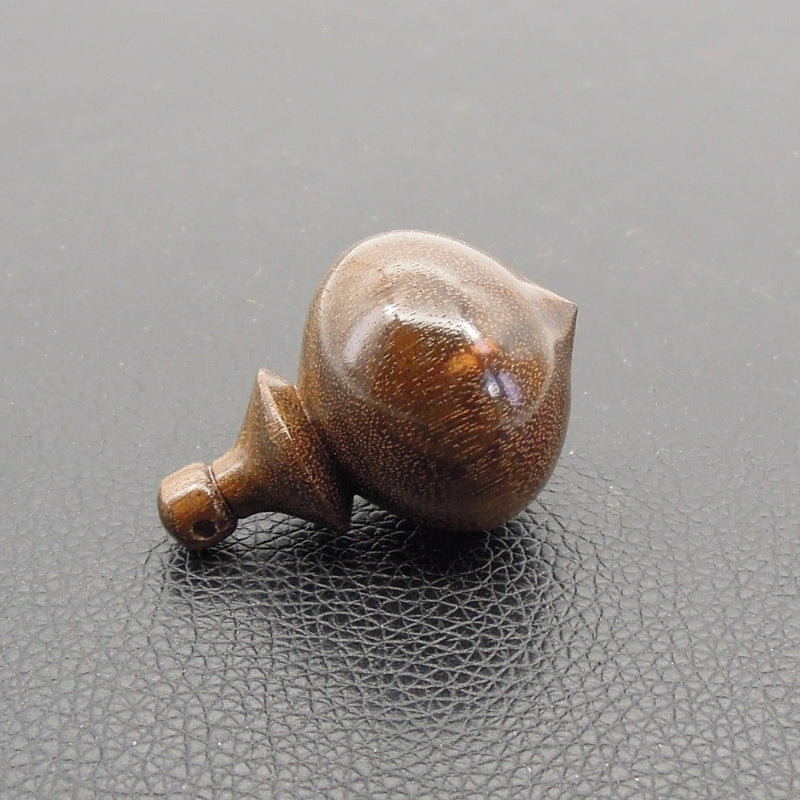 Pendule artisanal de radiesthésie en ziricote avec oeilleton.