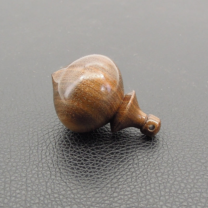 Pendule artisanal de radiesthésie en ziricote avec oeilleton.