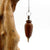 Pendule artisanal de radiesthésie en orme avec chainette et monture métal.