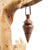 Pendule artisanal de radiesthésie en palissandre santos avec oeilleton.