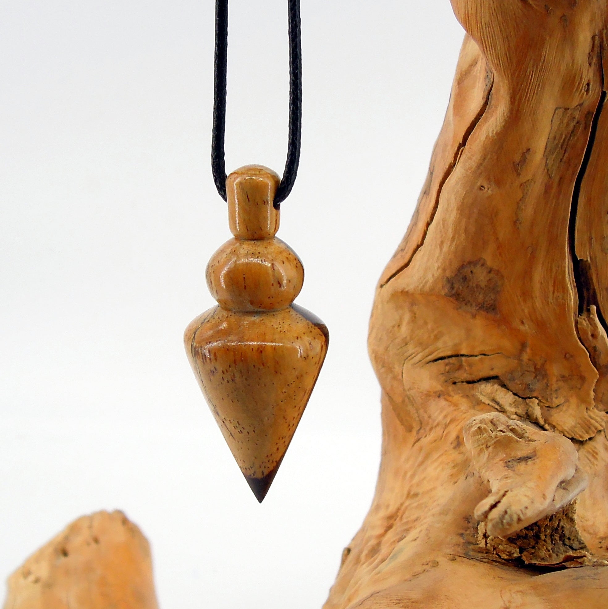 Pendule artisanal en cocobolo avec oeilleton